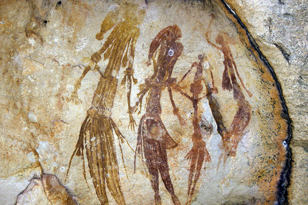 Giwon rock art figures with elaborate headdress and skirts